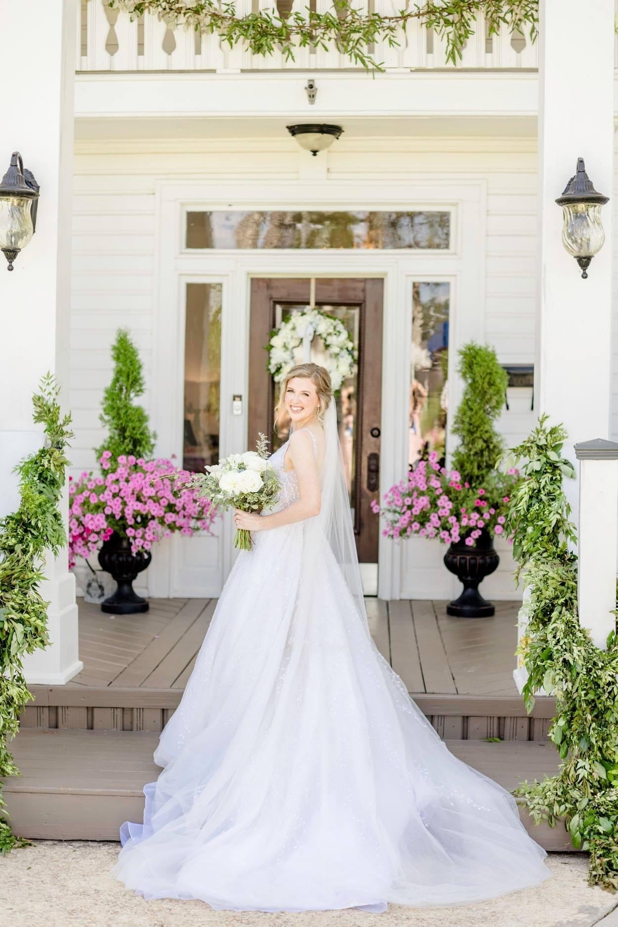 Hart Gown | A-line wedding dress with deep V neckline, delicate Ivory beading throughout bodice and skirt.